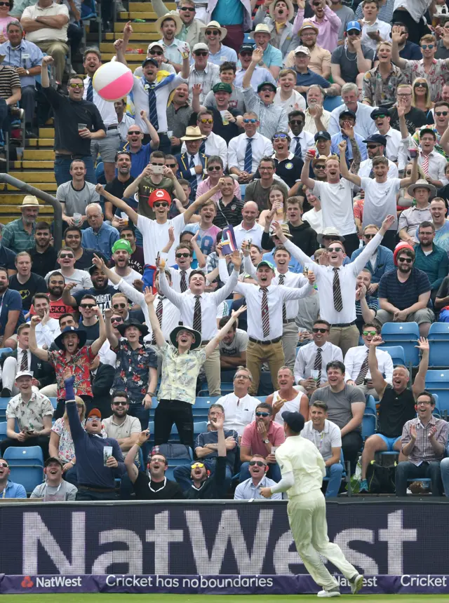 Keaton Jennings throws a beach ball back into the Western Terrace