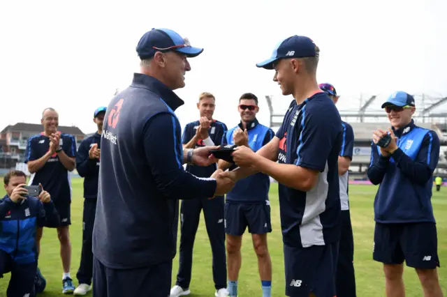 Sam Curran receives his England cap from Graham Thorpe