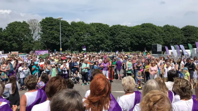 Crowd watching women's choir Only Menopause Aloud