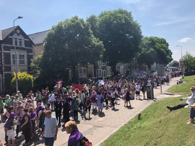 Procession participants walking through Cardiff