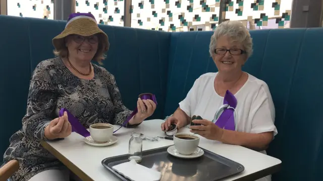 Elaine and Diana sitting whilst having a cup of tea