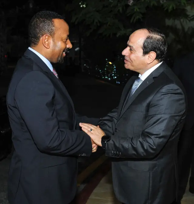 A handout picture released by the Egyptian Presidency on June 10, 2018 shows Egyptian President Abdel Fattah al-Sisi (R) receiving Ethiopian Prime Minister Abiy Ahmed