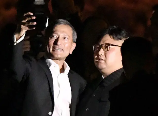 Singapore's Foreign Minister Vivian Balakrishnan takes a selfie with North Korea"s leader Kim Jong Un during a visit in Merlion Park in Singapore