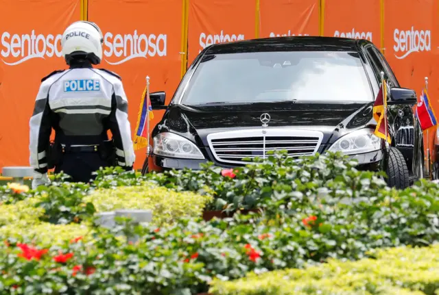 The motorcade of North Korea"s leader Kim Jong Un departs the Capella hotel on Sentosa island in Singapore