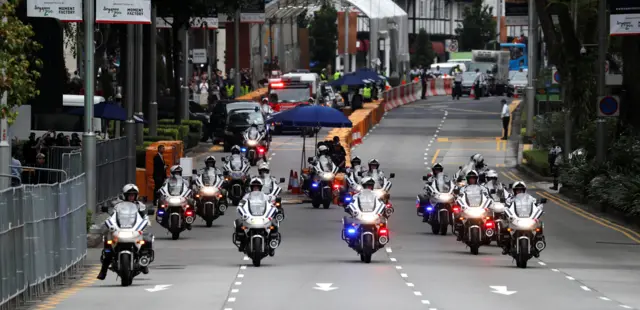 The motorcade of North Korean leader Kim Jong Un travels towards Sentosa for his meeting with US President Donald Trump, in Singapore June 12, 2018.