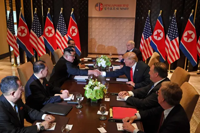 The North Korea delegation is seen with President Trump