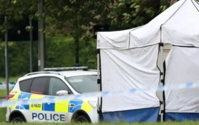 Police car and tent