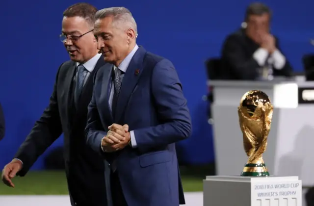 The chairman of the Morocco 2026 bid committee, Moulay Hafid Elalamy (R) and the president of the Moroccon soccer federation Fouzi Lekjaa leave the stage after the presentation of the Morocco 2026 FIFA World Cup bid