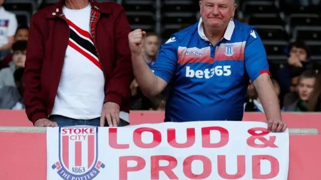 A Stoke City fan with banner last season