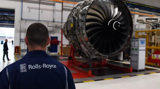 Rolls Royce employee and an engine