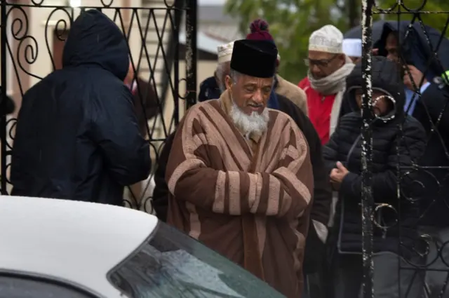 Muslim clerics emerge after visiting the mosque following a stabbing attack that left two worshippers dead and the attacker shot by the police on June 14, 2018