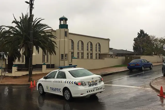 uth Africa police vehicle is parked outside the Malmesbury main mosque following a stabbing attack that left two worshippers dead