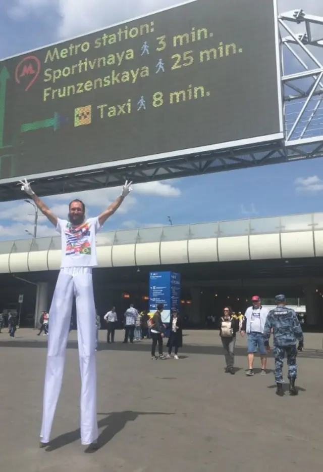 A stilt walker outside the Luzhniki Sadium