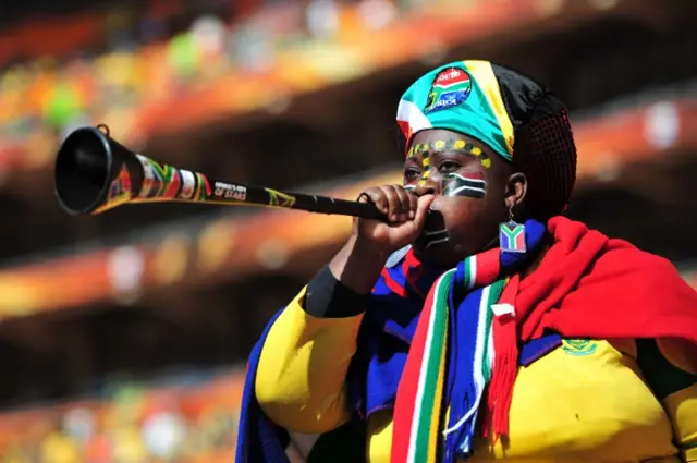 A South Africa supporter blows a Vuvuzela as she awaits the Opening Ceremony ahead of the 2010 FIFA World Cup