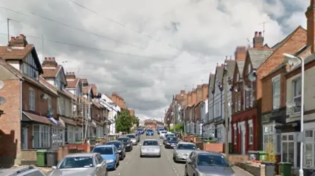 Cars parked on a street in Redditch