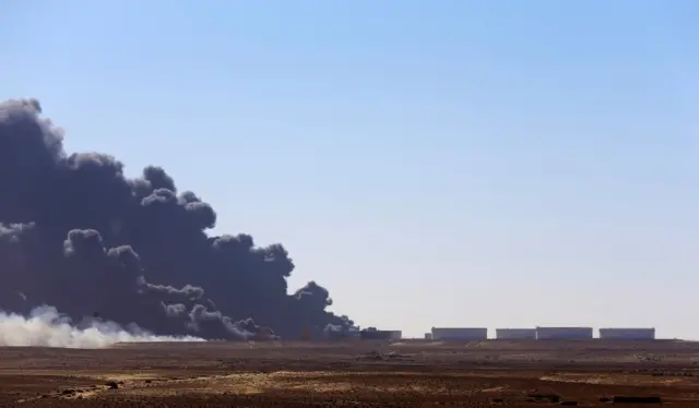 lack smoke billows out of a storage oil tank at the port of Es Sider in Ras Lanuf December 28, 2014.