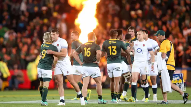 South Africa and England players shake hands