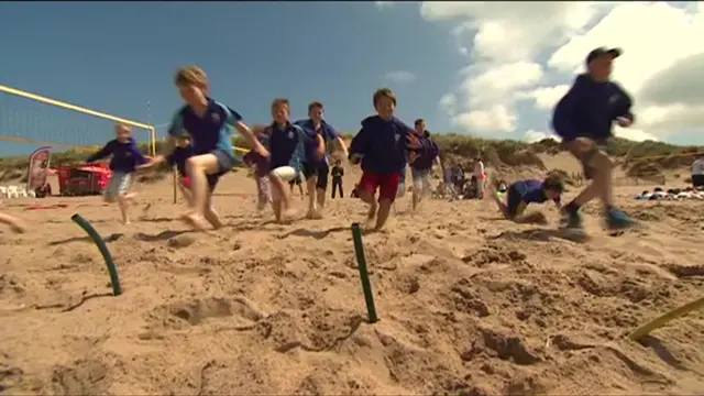 Children running on the beach