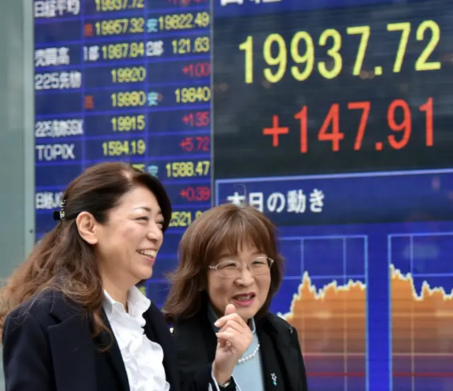 A board showing stocks in Japan