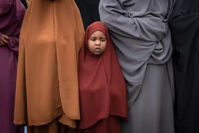 Kenyan Muslims take part in Eid al-Fitr prayer which marks the end of the holy month of Ramadan in the clicket field at Sir Ali Muslim Club on June 15, 2018.