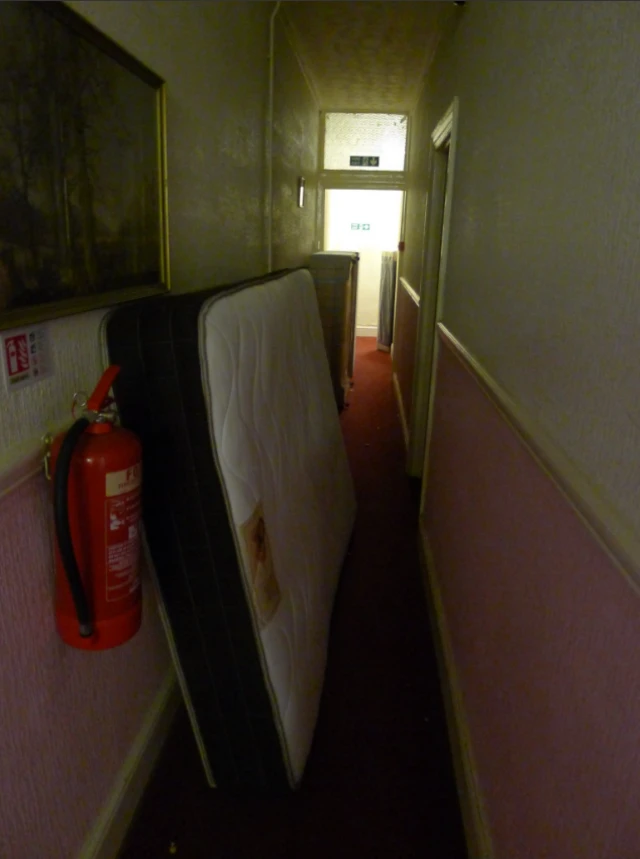 A mattress in a corridor