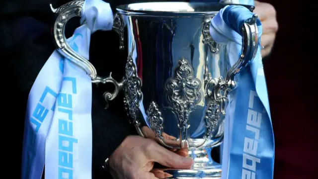 The Carabao Cup League Cup trophy in the colours of last season's winners, Man City