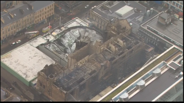 An aerial view of the fire scene shows the art school and the roof of the ABC music venue completely devastated