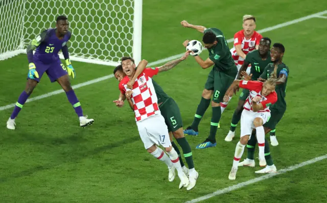 Nigeria's William Troost-Ekong fouls Croatia's Mario Mandzukic in the penalty area