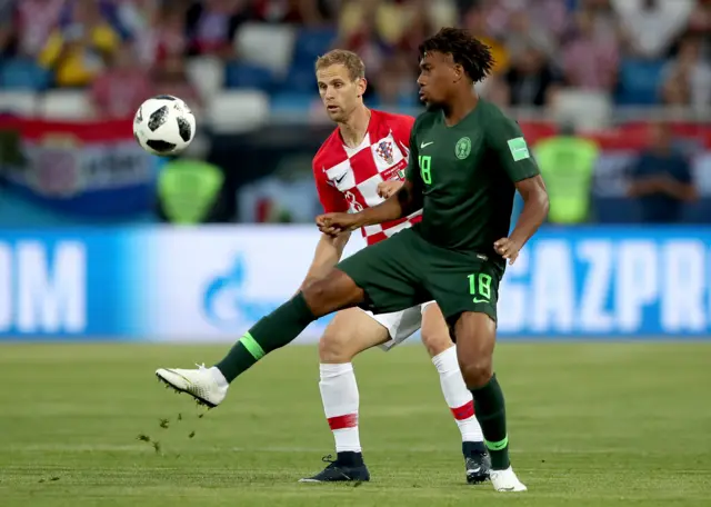 Ivan Strinic of Croatia (L) and Alex Iwobi of Nigeria