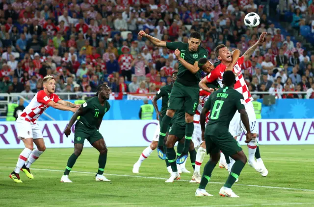 William Ekong of Nigeria pulls down Mario Mandzukic of Croatia