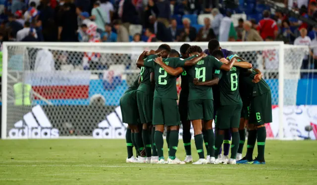 Nigeria players huddle at half time