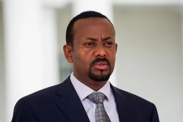 Abiy Ahmed attends a welcome ceremony for his two-day state visit at State House in Entebbe on June 8, 2018.