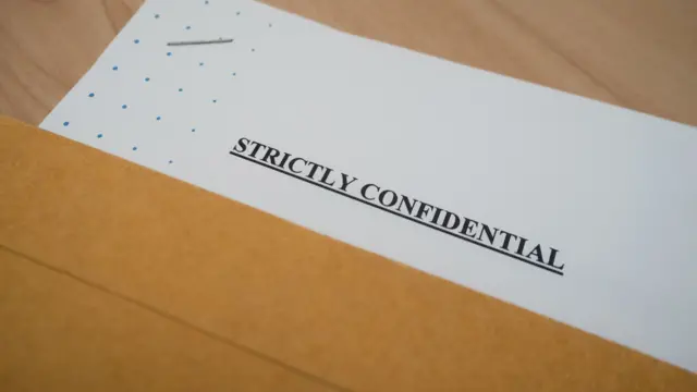 A document that reads: Strictly confidential