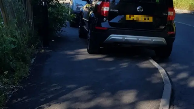 Car parked on pavement