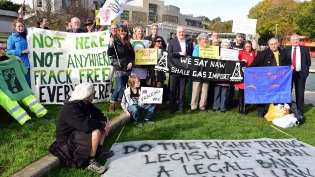 Scottish Green Party energy spokesperson Mark Ruskell (C) joins an anti-fracking demonstration outside the Scottish Parliament, as MSPs prepared to debate the issue, on October 24, 2017 in Edinburgh, Scotland.