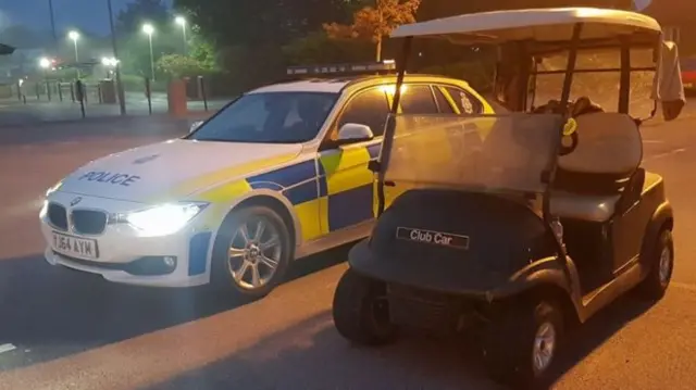 Police car and golf buggy