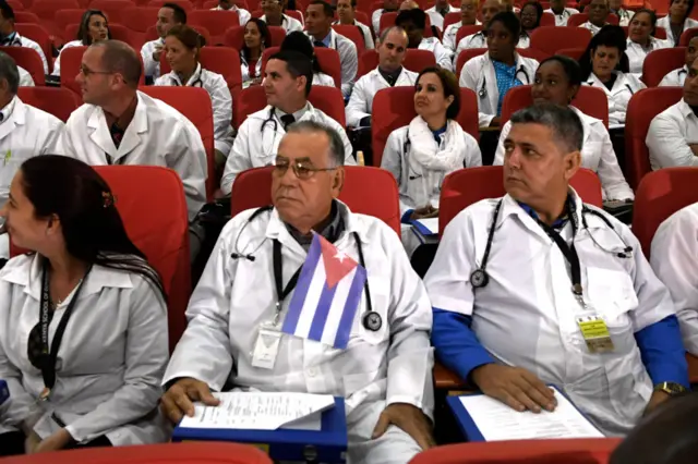 Some 100 Cuban doctors follow proceedings during their induction programme at the Kenya School of Government, on June 11, 2018 in Nairobi.