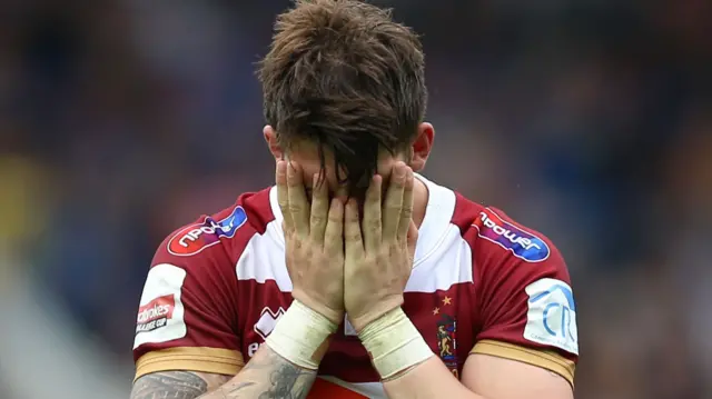 Wigan player dejected