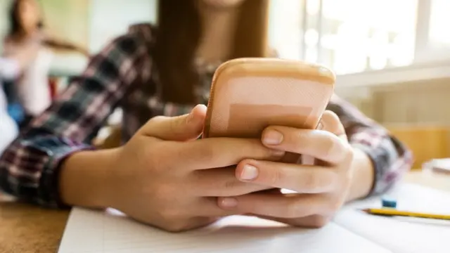 Student on mobile phone in the classroom