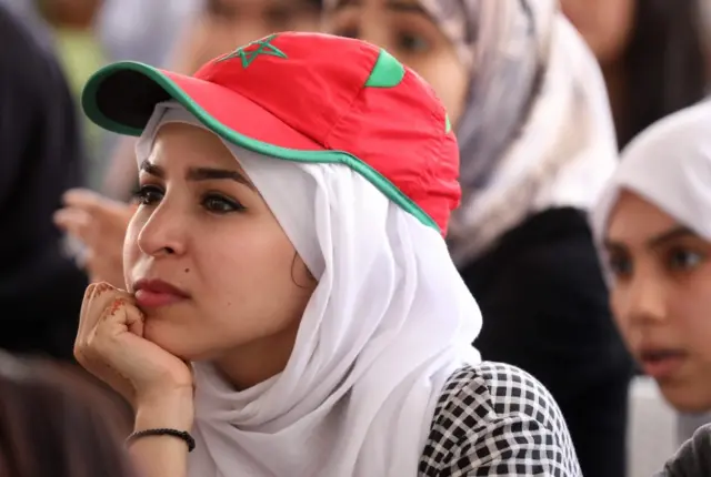 A Moroccan football supporter watches the Russia 2018 World Cup Group B football match between Morocco and Portugal on June 20, 2018, at a coffee shop in the capital Rabat