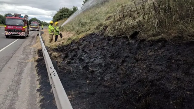 The grass fire being tackled