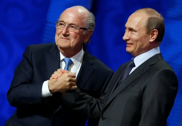 Sepp Blatter shakes hands with Russian President Vladimir Putin (R) during the preliminary draw for the 2018 FIFA World Cup at Konstantin Palace in St. Petersburg, Russia July 25, 2015