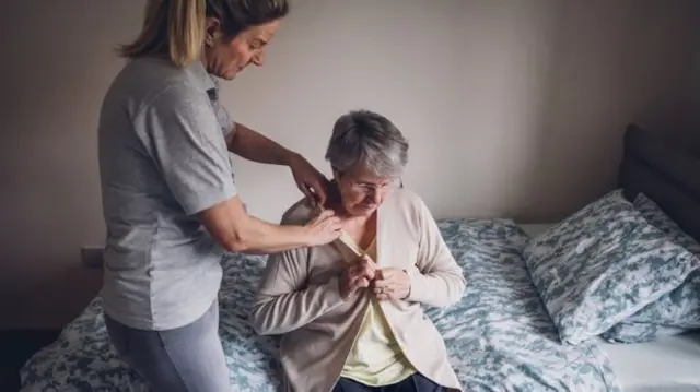 Carer and elderly woman