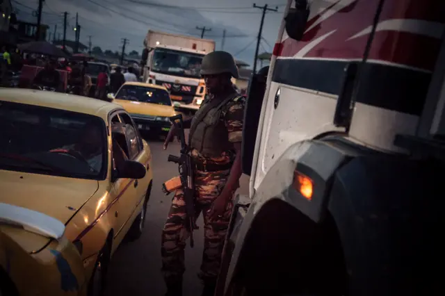 Soldiers of the 21st Motorized Infantry Brigade patrol in the streets of Buea, South-West Region of Cameroon on April 26, 2018