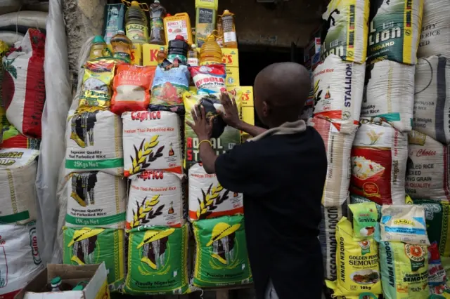 A vendor arranges bags of rice at the Wuse market in Abuja, Nigeria May 15, 2018