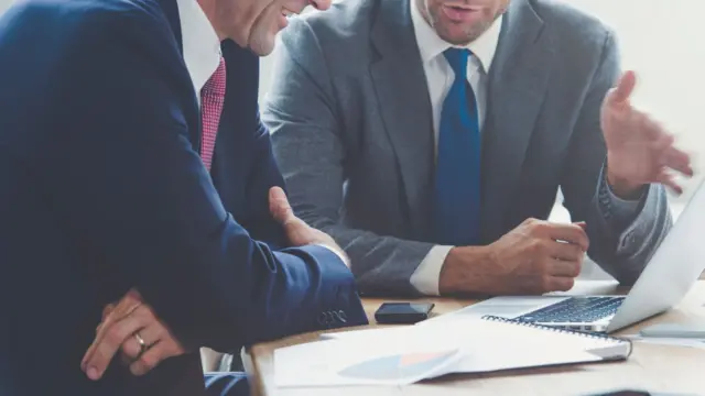 two men in a meeting