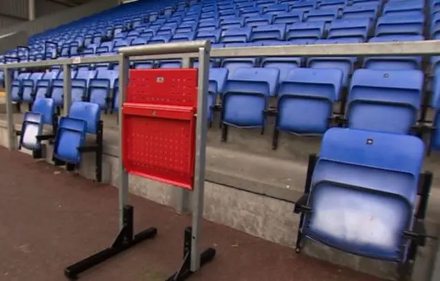 Seats in stand next to safe standing seat