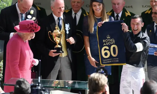 The Queen watches Frankie Dettori celebrating after winning the Gold Cup