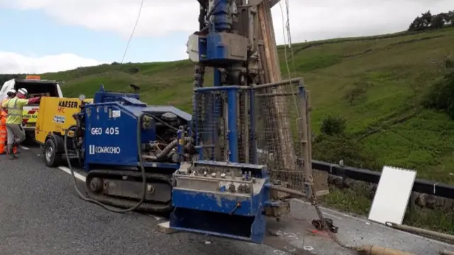 Drilling rig on top of road surface