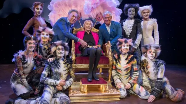 Gillian Lynne with the cast of Cats and Sir Andrew Lloyd Webber